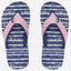 A pair of flip-flops with navy blue and white wavy patterned soles and glittery pink straps
