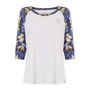 A women's 3/4 sleeve tunic top with a solid white body and navy blue sleeves featuring a yellow and white floral pattern. Main image