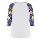 A women's raglan baseball tee with a solid white body and 3/4 sleeves featuring a navy blue and yellow floral pattern